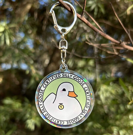 Certified Silly Goose Acrylic Keychain An acrylic keychain with double sided printing of 'Certified Silly Goose' design. Back side has a holographic shards finish.