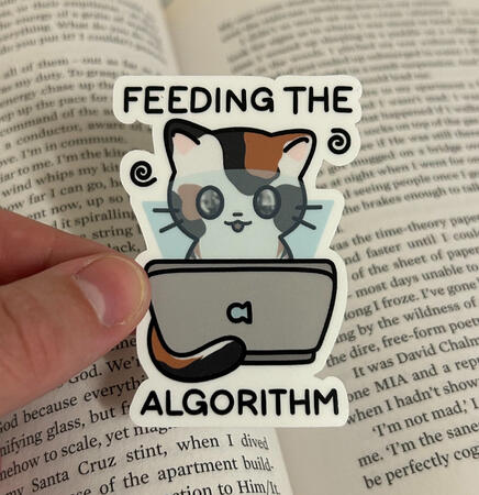 Handmade 'Feeding the Algorithm' die cut sticker. Printed on printable sticker paper, protected with holographic laminate and cut using Cricut Explore 4.